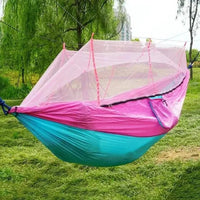 Mandotos Traveler's Mosquito-Free Hammock with mesh sides and compact design for outdoor relaxation and insect protection.