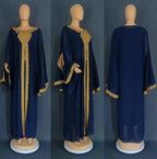 Mandotos two-piece gold kaftan abaya dress with flowing fabric and intricate detailing, perfect for elegant occasions.