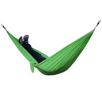 Mandotos Ultimate Oasis single and double hammock with sturdy fabric and wooden spreader bars, perfect for outdoor relaxation.