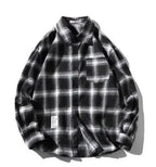 Unisex checkered long sleeve shirt by MANDOTOS featuring a classic black and white checkered pattern and button-up front.