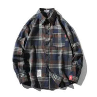 Unisex checkered long sleeve shirt by MANDOTOS featuring a classic black and white pattern, casual fit, and button-up front.