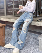 Plus size American Hole high waist straight-leg denim pants for women by MANDOTOS, showing front view with distressed details.