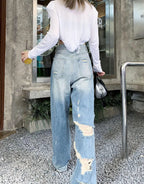 Plus size American Hole high waist straight-leg denim pants for women by MANDOTOS, showcasing the trendy distressed denim style.