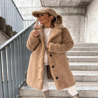 Women's wool coat by MANDOTOS featuring a cozy lamb wool design, tailored fit, and classic style for cold weather.