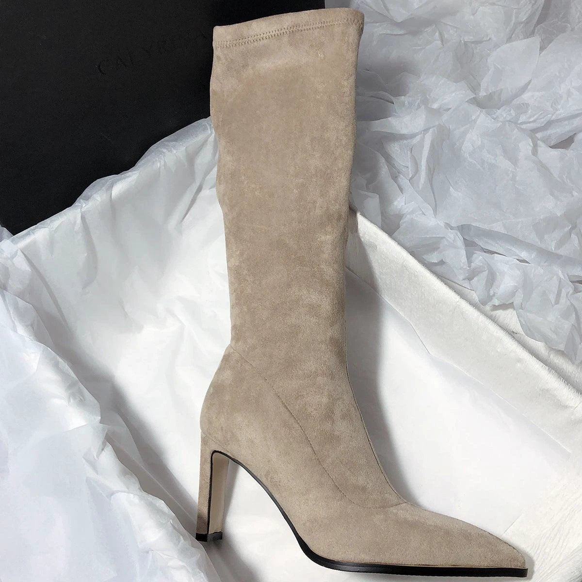Women's high heel stretch below-the-knee boots by MANDOTOS, showcasing sleek design and fitted silhouette in black leather.
