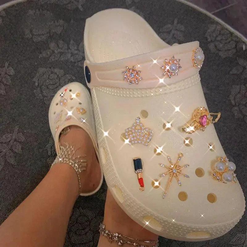 Comfortable women’s slippers and clogs by MANDOTOS, featuring soft fabric and slip-on design for cozy indoor wear.
