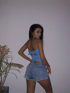 Mandotos Xuan Ya high-waisted denim shorts with hip zipper, casual summer style, showcasing the fit and trendy design.