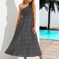 Mandotos Zoe asymmetrical midi dress featuring a flowy silhouette and stylish design, shown in a vibrant fabric.
